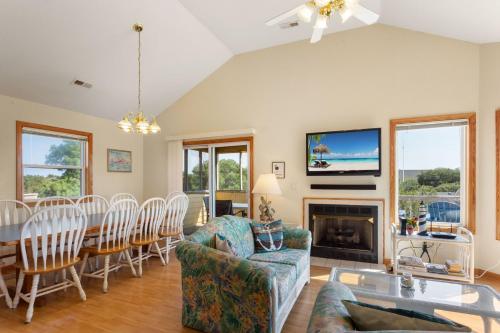 a living room with a couch and a table and a fireplace at 1680 - Hopes and Dreams in Poplar Branch