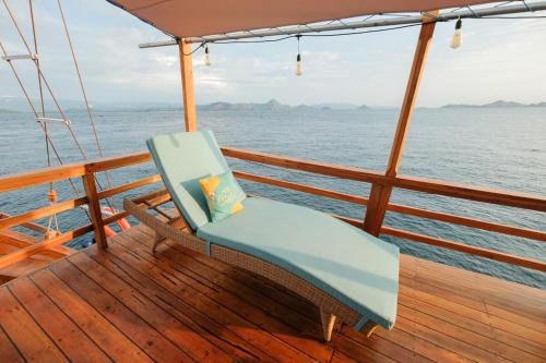 a chair sitting on the deck of a boat at Luxury Private Phinisi Sailing in Komodo island in Labuan Bajo