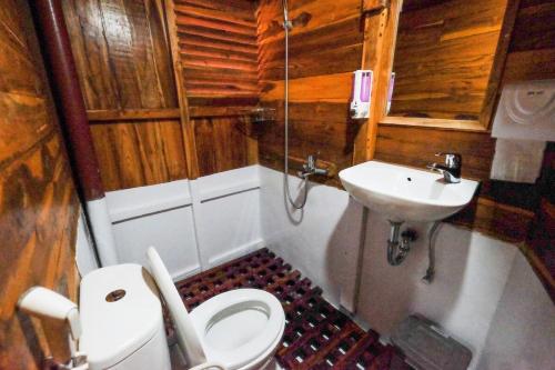 a bathroom with a toilet and a sink at Luxury Private Phinisi Sailing in Komodo island in Labuan Bajo