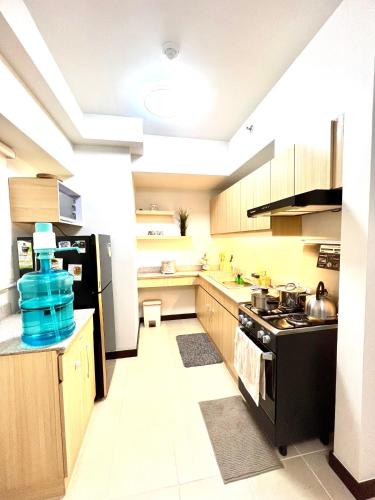 Una cocina o cocineta en Angels Place The Atherton, Manila Condo Near Airport