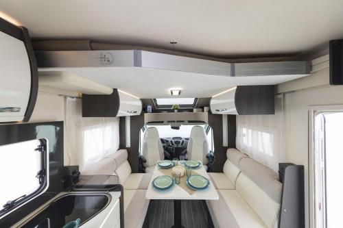 a view of the inside of an rv with a table at ATHENS MOTORHOME park KRONOS 261 CAMPER in Pallíni