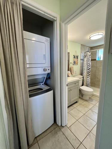 a bathroom with a stove and a microwave at Menehune Shores 227 condo in Kihei
