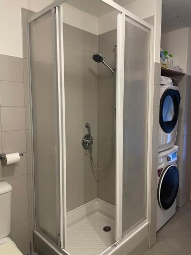 a shower with a glass door in a bathroom at La Casa nel Bosco - In collina a 10 minuti dal mare in Casarza Ligure
