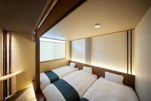 Ένα ή περισσότερα κρεβάτια σε δωμάτιο στο Hotel Senka Osaka