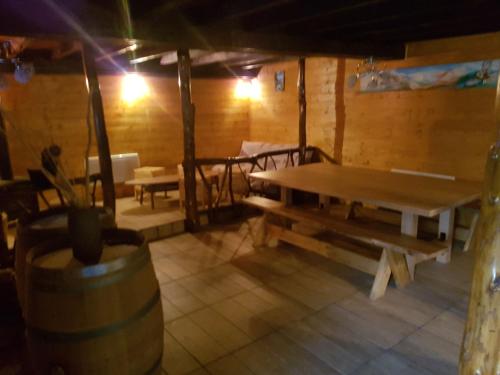 a room with a table and benches in a building at gîte, grange aménagée in Luz-Saint-Sauveur