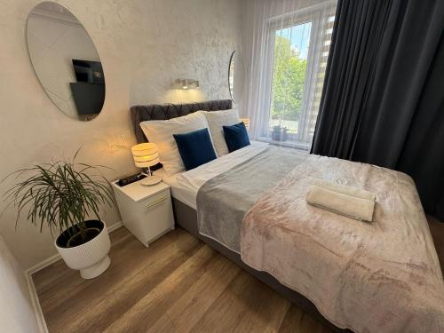 Postel nebo postele na pokoji v ubytování Apartament Lena