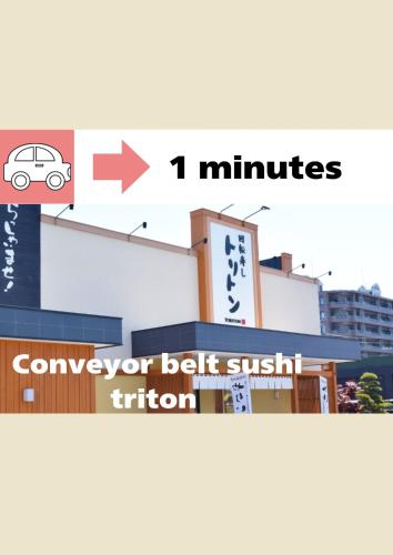 a sign with a car on the side of a building at The SKY in Sapporo
