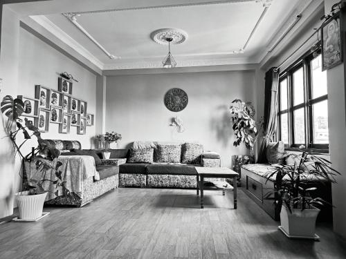 a living room with a couch and a table at Shova's Home Stay in Kathmandu