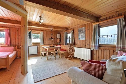 a living room with a table and a dining room at Oberseebachhof in Scheffau am Wilden Kaiser