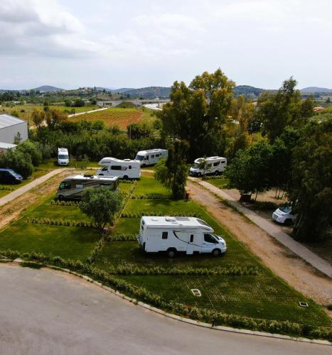 an aerial view of a group of parked rvs at ATHENS MOTORHOME park RV WINNEBAGO in Pallíni