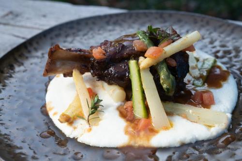 a plate of food with meat and vegetables on it at Hotel Montafoner Hof in Schruns-Tschagguns