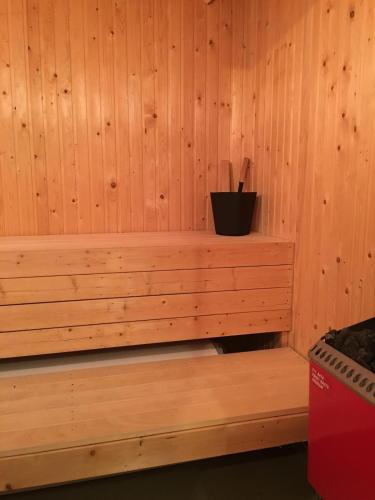 a wooden paneled room with a bench in a sauna at Cozy cottage in Tandådalen, Sälen, Dalarna, Sweden in Sälen