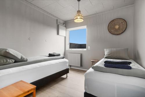 Postel nebo postele na pokoji v ubytování Ocean Break Cabins