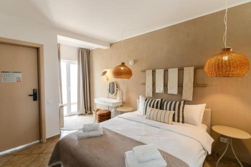 En eller flere senge i et værelse på Rezident Villa Eforie