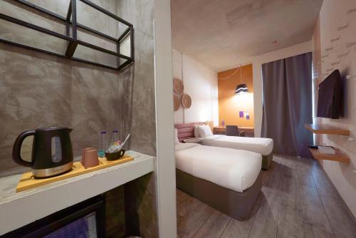 a hotel room with two beds and a fireplace at Dara Al Yammamah Hotel - Formerly Nuzl Shada in Jeddah