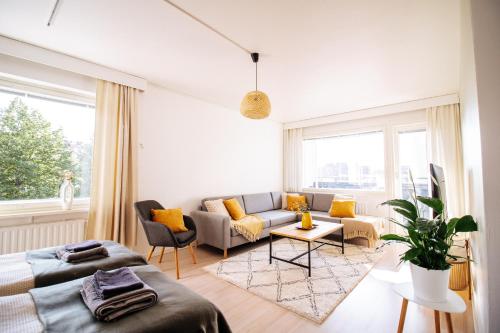 Ruang duduk di Come in! "Pirkanportti" In the heart of Tampere next to the railway station for 9 people!