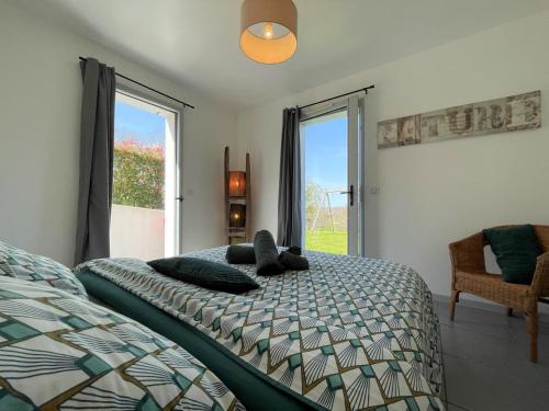 a bedroom with a bed and a window at Haritza in Ahetze