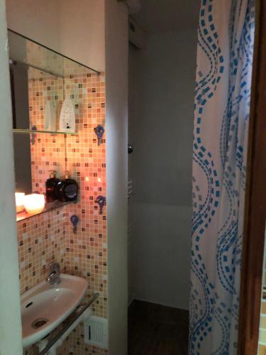 a bathroom with a sink and a mirror at Apartmány na náměstí - Kounice in Kounice