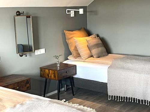 Una cama o camas en una habitación de Lindarhóll Guesthouse