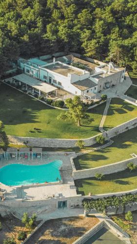 an aerial view of a house with a swimming pool at Masseria Panareo in Otranto