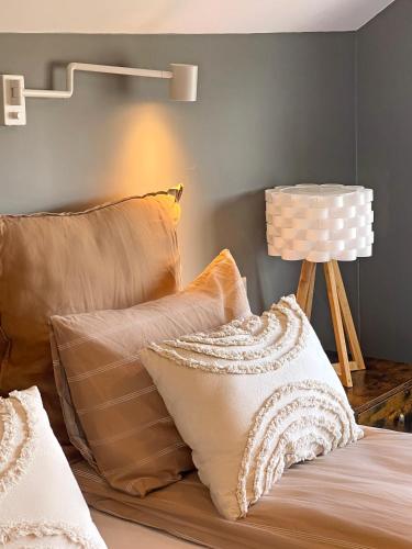 Una cama o camas en una habitación de Lindarhóll Guesthouse