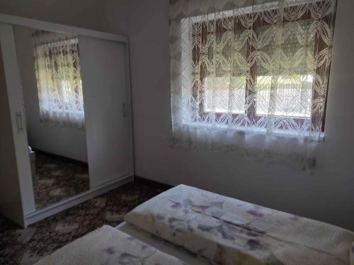 A bed or beds in a room at Holiday home in Balatonfenyves 18431