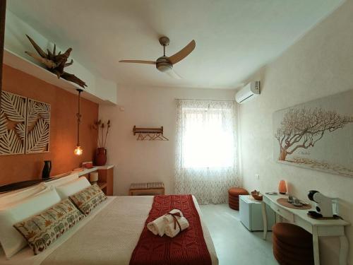 a bedroom with a large bed and a window at Terrammare del Golfo in Castellammare del Golfo