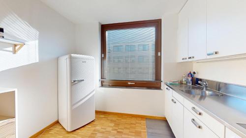 Η κουζίνα ή μικρή κουζίνα στο Schönau Serviced Living