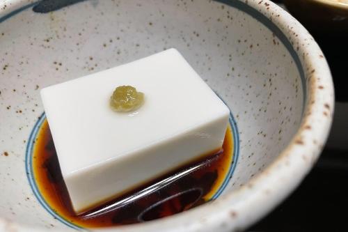 a piece of cake in a bowl with sauce at 高野山 宿坊 光明院 -Koyasan Shukubo Komyoin- in Koyasan