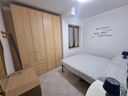 Ένα ή περισσότερα κρεβάτια σε δωμάτιο στο A Casa Ma&Mi