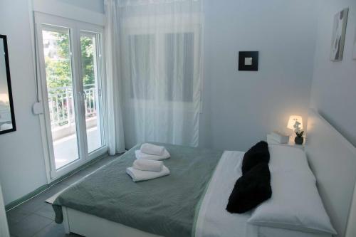 Ένα ή περισσότερα κρεβάτια σε δωμάτιο στο Marianne's Apartment