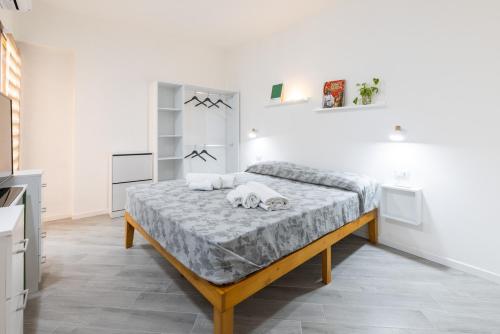 Ένα ή περισσότερα κρεβάτια σε δωμάτιο στο Urban Rooms