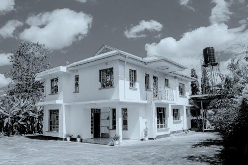 a black and white photo of a house at Misenani House njiro in Arusha