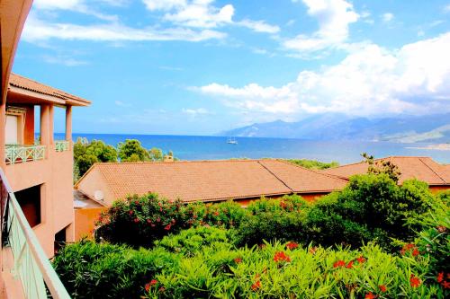 a view of the ocean from a balcony of a house at Résidence Privée Suarella in Saint-Florent
