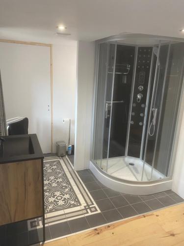 a large glass shower in a living room at Chambres d’hôtes La Voûte in Volonne