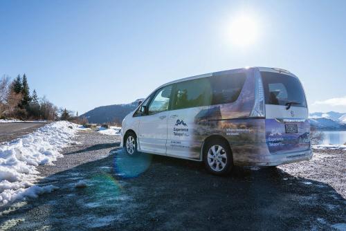 a white van parked next to a fire hydrant at Lake Lodge Tekapo in Lake Tekapo
