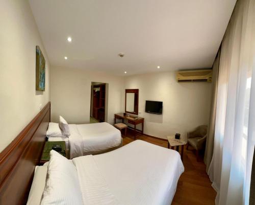 Ένα ή περισσότερα κρεβάτια σε δωμάτιο στο Hotel Royal Marshal