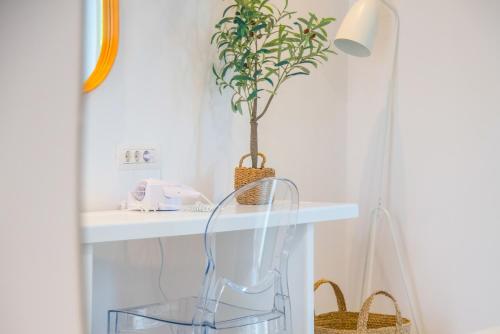 a bathroom with a glass shelf and a plant at Princess Hotel in Lassi