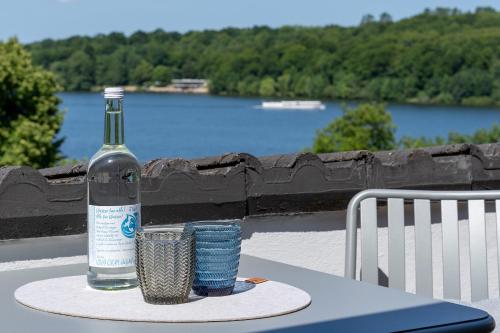 a bottle of wine sitting on top of a table at Haus Dieksee Holm Dieksee-Idyll in Gremsmühlen