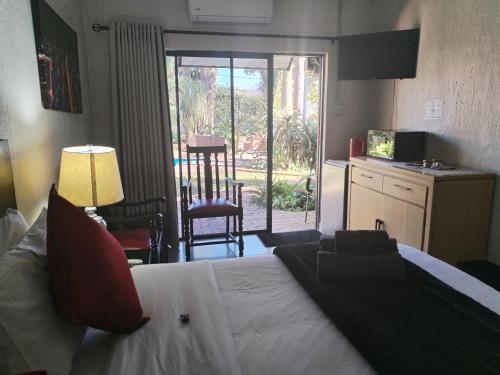 Ένα ή περισσότερα κρεβάτια σε δωμάτιο στο Waterfront Guest House