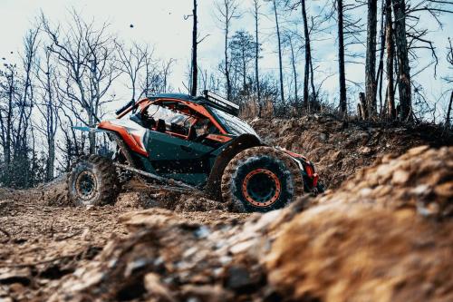 a off road truck driving down a dirt road at Peaceful Smoky Treehouse| Hot Tub • Hammock • Deck in Line Spring