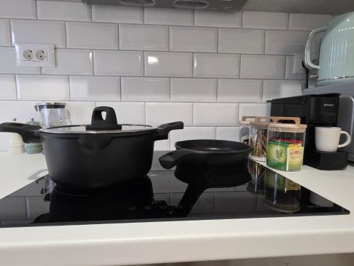 a kitchen counter with a stove top in a kitchen at Elounda Alley in Elounda