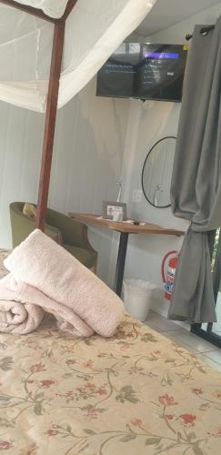 Postel nebo postele na pokoji v ubytování Kruger Allo B&B