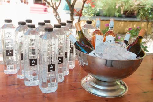 a bucket full of bottles of wine and ice at Hotel La Residenza in Timişoara