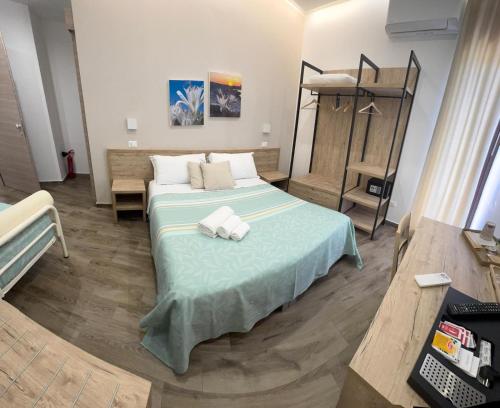 Postel nebo postele na pokoji v ubytování B&B Giglio di mare