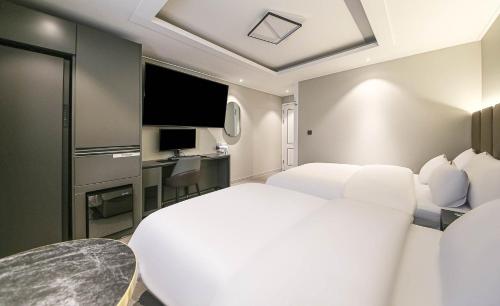 Cama o camas de una habitación en Chungju Browndot Cityhall