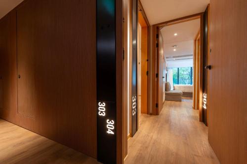 a hallway of a house with a sign on the wall at Shama Hub Metro South Hong Kong in Hong Kong