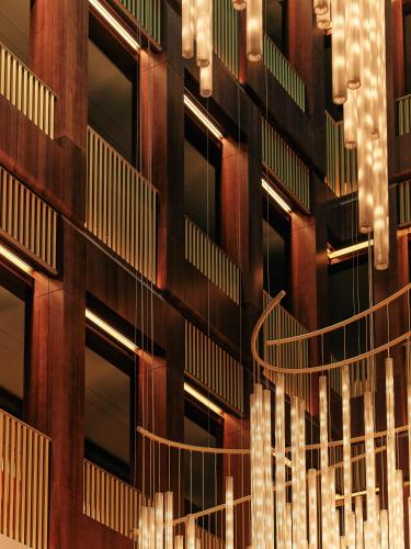 a building with lights on the side of it at The Chancery Rosewood in London
