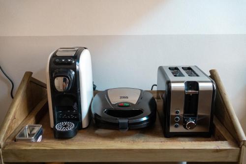 a wooden shelf with various appliances on it at Paciocchella in Civita Castellana