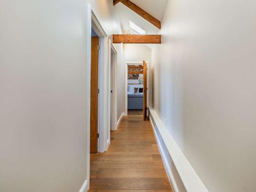 a hallway of a home with white walls and wood floors at 3 bed in Barnstaple 09092 in Umberleigh Bridge
